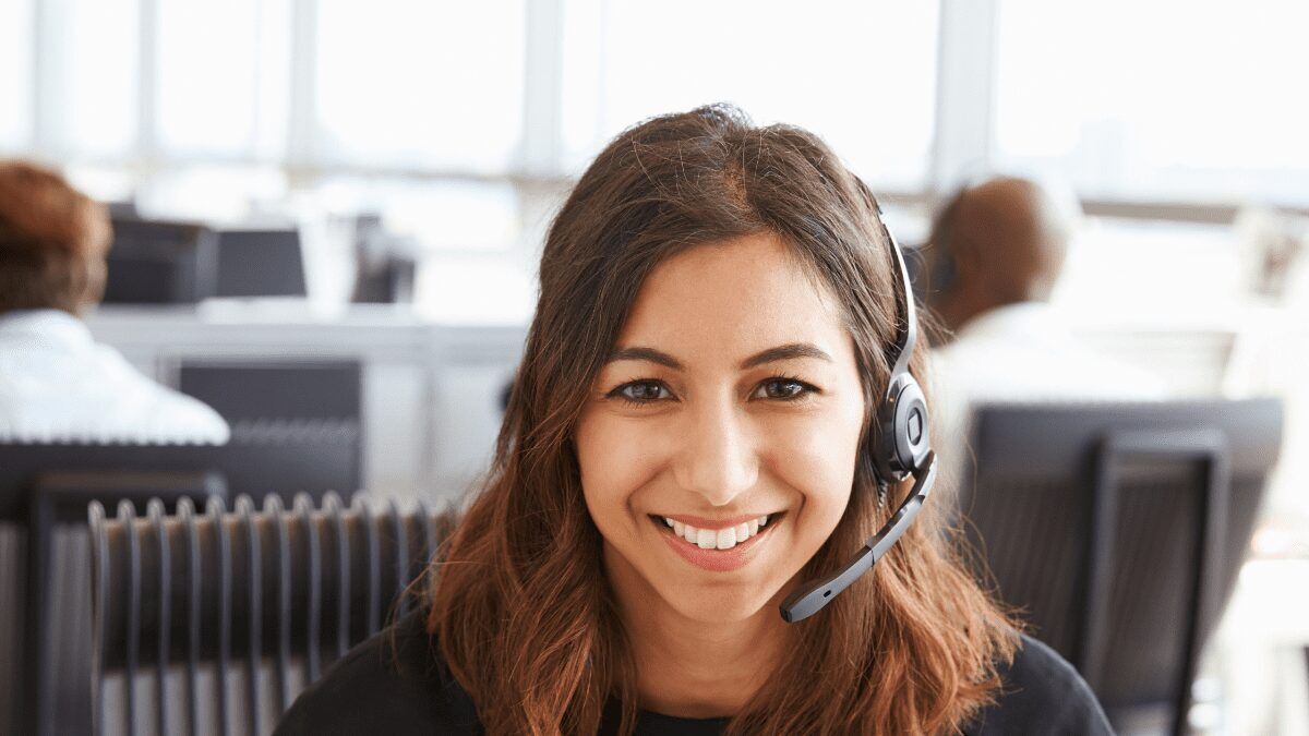 Call Center Agent girl smiling with a headset on Canva-Call-center-agent