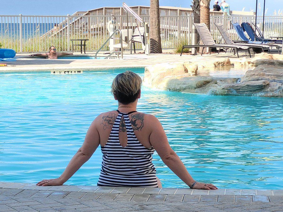 Kathy Brown relaxes poolside at the Hilton Garden Inn Fort Walton Beach, soaking up the Florida sunshine and enjoying the turquoise waters of the Gulf Coast.