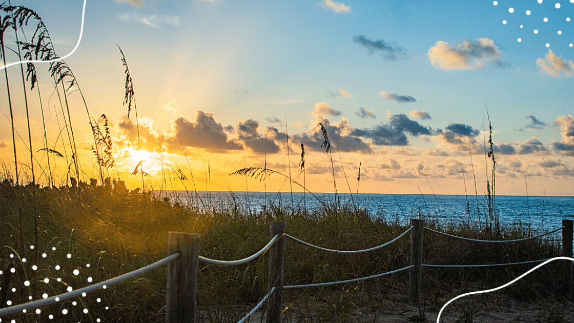 hues of twilight cast a warm embrace over Deerfield Beach, painting a serene canvas through the natural dunes and gently swaying seagrass.