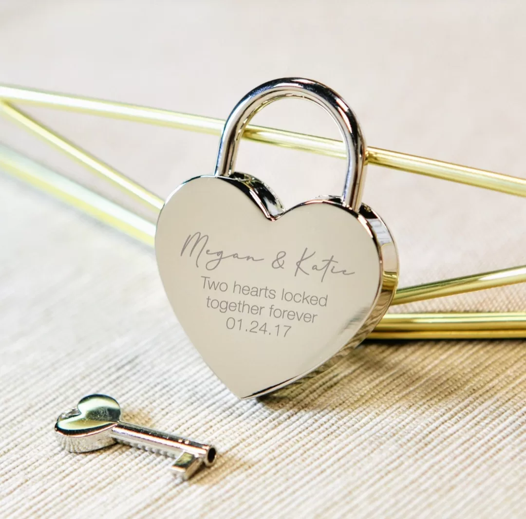 Shiny silver and gold heart-shaped padlock, a symbol of enduring love and elegance.